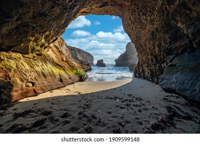 A small cave in the bay of shark fin, beautiful beach landscape on the coast of the California Highway, ocean, rocks, great sky, clear sunny weather. - Powered by Shutterstock