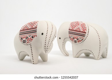 Small ceramic elephant  isolated on white background.