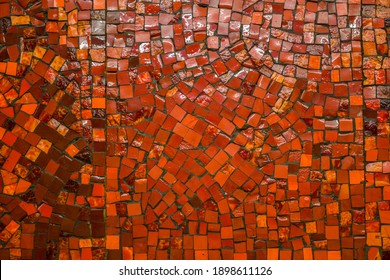 Small ceramic mosaic. Abstract background, glossy texture of mosaic tiles on the wall. Custom-sized red mosaic tiles in the background. space for text. - Shutterstock ID 1898611126