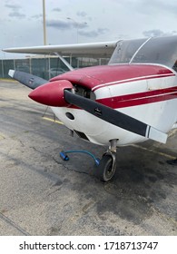 Small Cessna Plane. The Cockpit, The Propeller And The Landing Gear Of The Light Aircraft. Piston Powered Aircraft