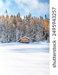 A small chalet in a snowy moutain