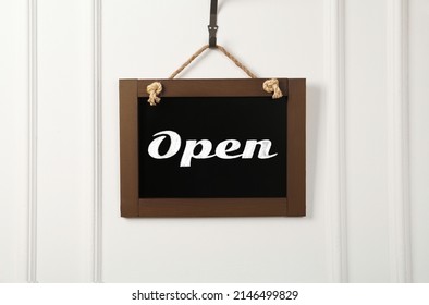 Small Chalk Board With Word Open On White Wall