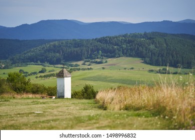 Small chapel in the meadows of eastern Slovakia in region Spis, part of Stations of the Cross or the Way of the Cross. Beautiful nature or countryside in the carpathian mountains in the summer day. - Shutterstock ID 1498996832