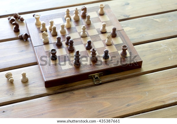 Small Chess Hand On Wood Table Stock Photo Edit Now 435387661