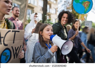 Small child with amplifier on global strike for climate change. - Powered by Shutterstock