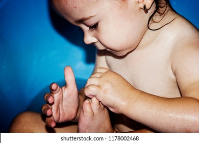 A small child is bathing