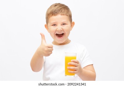 Small Child Boy Offering A Glass With Fresh Orange Juice And Smiling Isolated On White Background