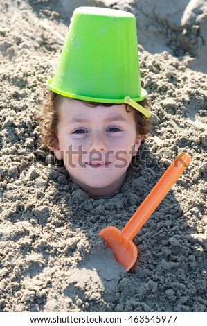 Similar – Image, Stock Photo Small child buried in the sand of the beach