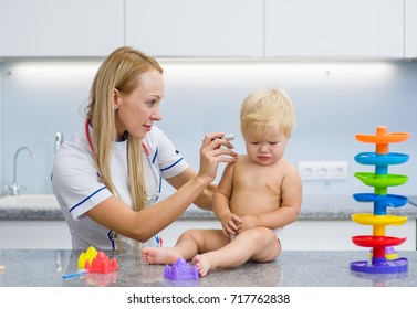 Small Child At The Doctor's Office With Pain In The Ear