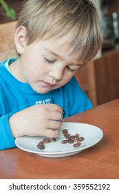 Small Child Eating Raisins