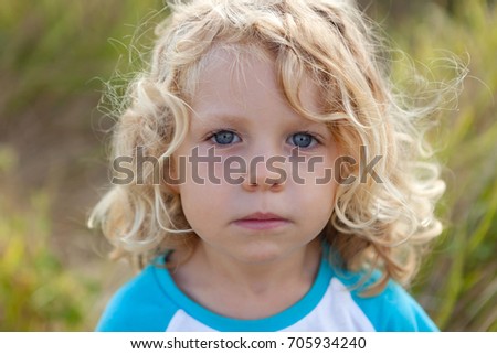 Similar – Small child with long blond hair