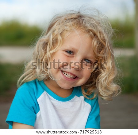 Similar – Small child with long blond hair enjoying of a sunny day