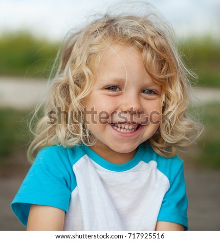 Similar – Small child with long blond hair enjoying of a sunny day