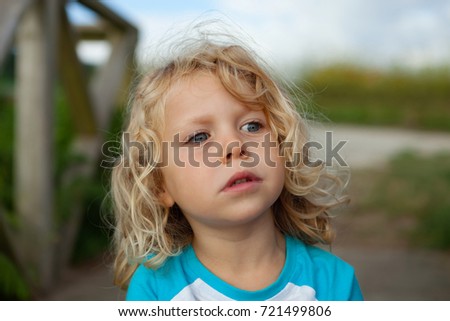 Similar – Small child with long blond hair