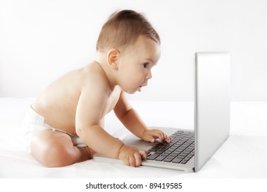 small child on a computer on a white background.