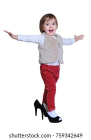 The Small Child On Heels, On The Isolated White Background.