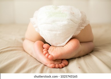 small child is sleeping in a diaper
