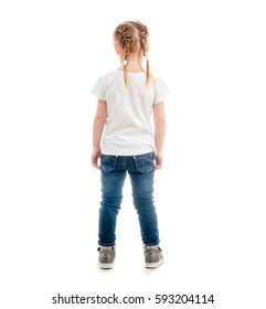 Small Child Standing With Her Back Turned, Wearing White T-shirt And Blue Jeans, Isolated