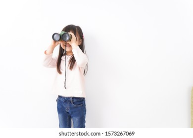 Small Child Using A Binoculars