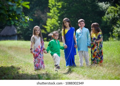 A lot of small children, boys and girls, dressed in the clothing culture of India. Girls Sarah. The children have fun. - Shutterstock ID 1088302349