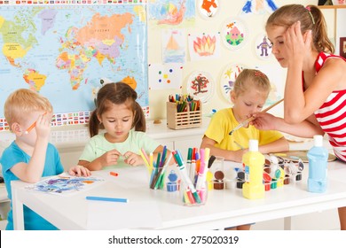 Small Children Draw In The Classroom