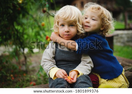 Similar – Foto Bild Bruder und Schwester von Hinten am Zaun