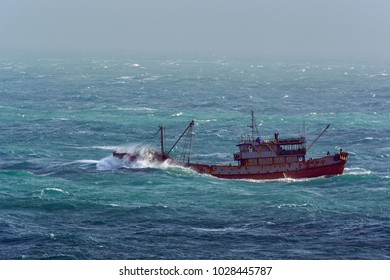 Small Chinese Trawler Pounds Through Rough Seas As It Crosses The South China Sea.