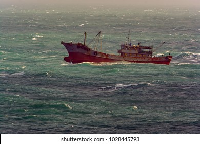 Small Chinese Trawler Pounds Through Rough Seas As It Crosses The South China Sea.