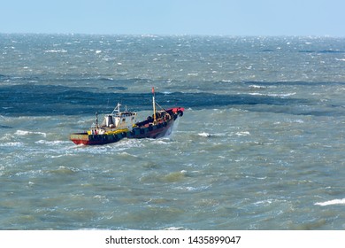 Small Chinese Trawler Pounds Through Rough Seas As It Crosses The South China Sea.