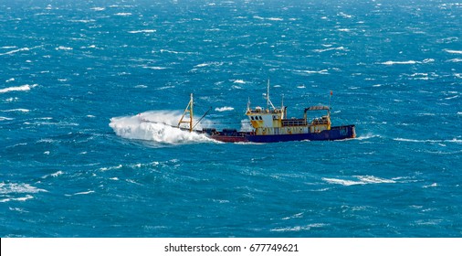 Small Chinese Trawler Pounds Through Rough Seas As It Crosses The South China Sea.