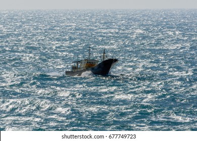 Small Chinese Trawler Pounds Through Rough Seas As It Crosses The South China Sea.