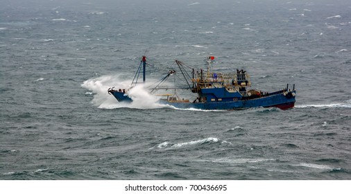 Small Chinese Trawler Pounds Through Rough Seas As It Crosses The South China Sea.