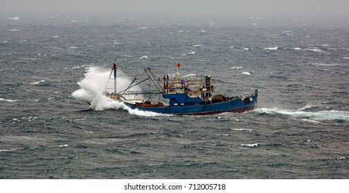 Small Chinese Trawler Pounds Through Rough Seas As It Crosses The South China Sea.