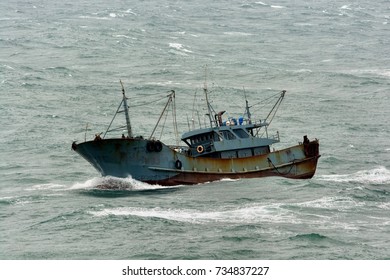 Small Chinese Trawler Pounds Through Rough Seas As It Crosses The South China Sea.