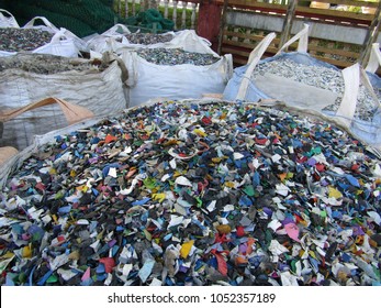 Small Chips From Plastic Soft Drink, Mineral Water Bottle And Plastic Scrap At The Recycling Center In Slim River Perak, Malaysia.