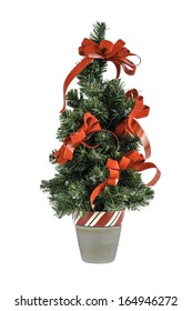 A Small Christmas Tree With Red Bows Isolated On A White Background.