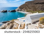 Small church overlooking amazing Agios Nikolaos bay and beach, Folegandros island, Cyclades, Greece