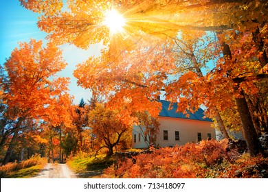 Small Church In Typical New England Town With Fall Foliage