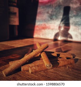 Small Cigars With Artistic Whiskey Bottle Shadow In Background. Bournemouth Dorset England UK. 23 December 2019.