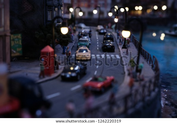 A small city in a miniature size displays busy\
scene of road, transport, people or commuters, cars van and lamp\
posts along the way. Very cute and beautiful town indeed.  Welcome\
to a small world!