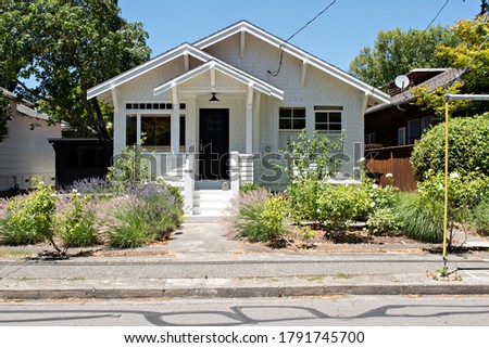 Small Classic White Shingle House in the Neighborhood
