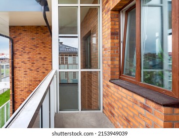 Small Clean Cozy Glass Balcony With Windows City Apartment Red Brick Wall Building