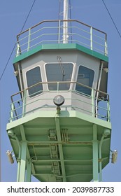 
small cockpit of a ship colored in green and gray