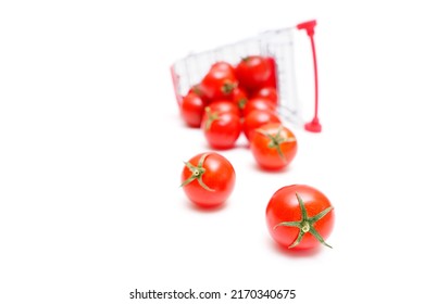 Small Cocktail Tomatoes Roll Out Of A Push Cart That Lies On Its Side, Selective Focus.