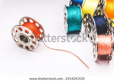 Small colorful spools of thread for sewing