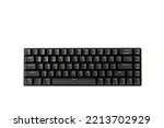Small compact black gaming computer keyboard on a white background. Keyboard with mechanical switches for gadgets and computer. Copy space. Close-up