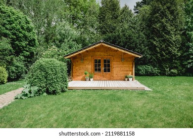 Small cottage in the countryside. Garden house made of wood. Cottage in your own garden for hobbies and free time during the pandemic. Shed in a large garden in Germany 