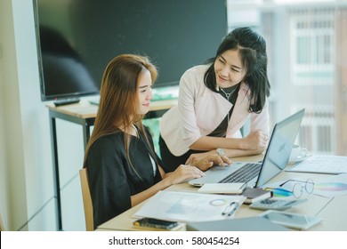 Small Couple Of Young People At A Business Meeting In Meeting Room. Bussiness Training Concept. 