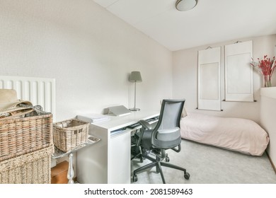 Small Cozy Bedroom With A Bed On The Floor And A Work Area