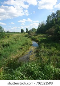 Small Creek Drain With Woods And Fields